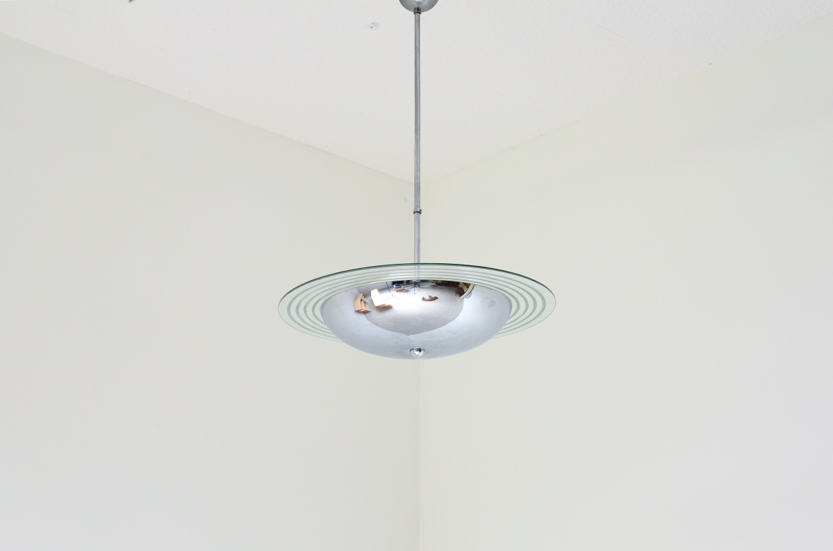 Chromed metal chandelier with cut and engraved crystal disc.  Italian manufacture ca. 1960.