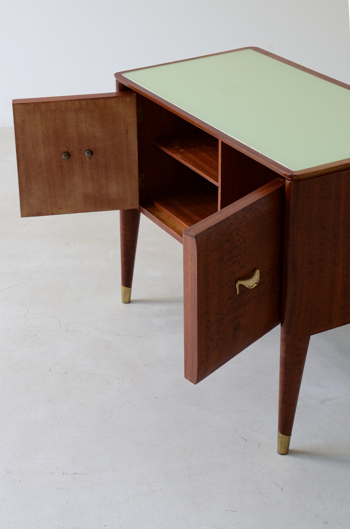 Pair of bedside tables with tapered legs, brass tips and handles 1950's