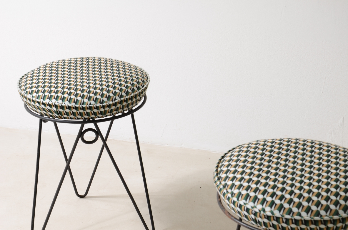 Pair of stools with wrought iron base and fabric seat.  France, 1950ca.