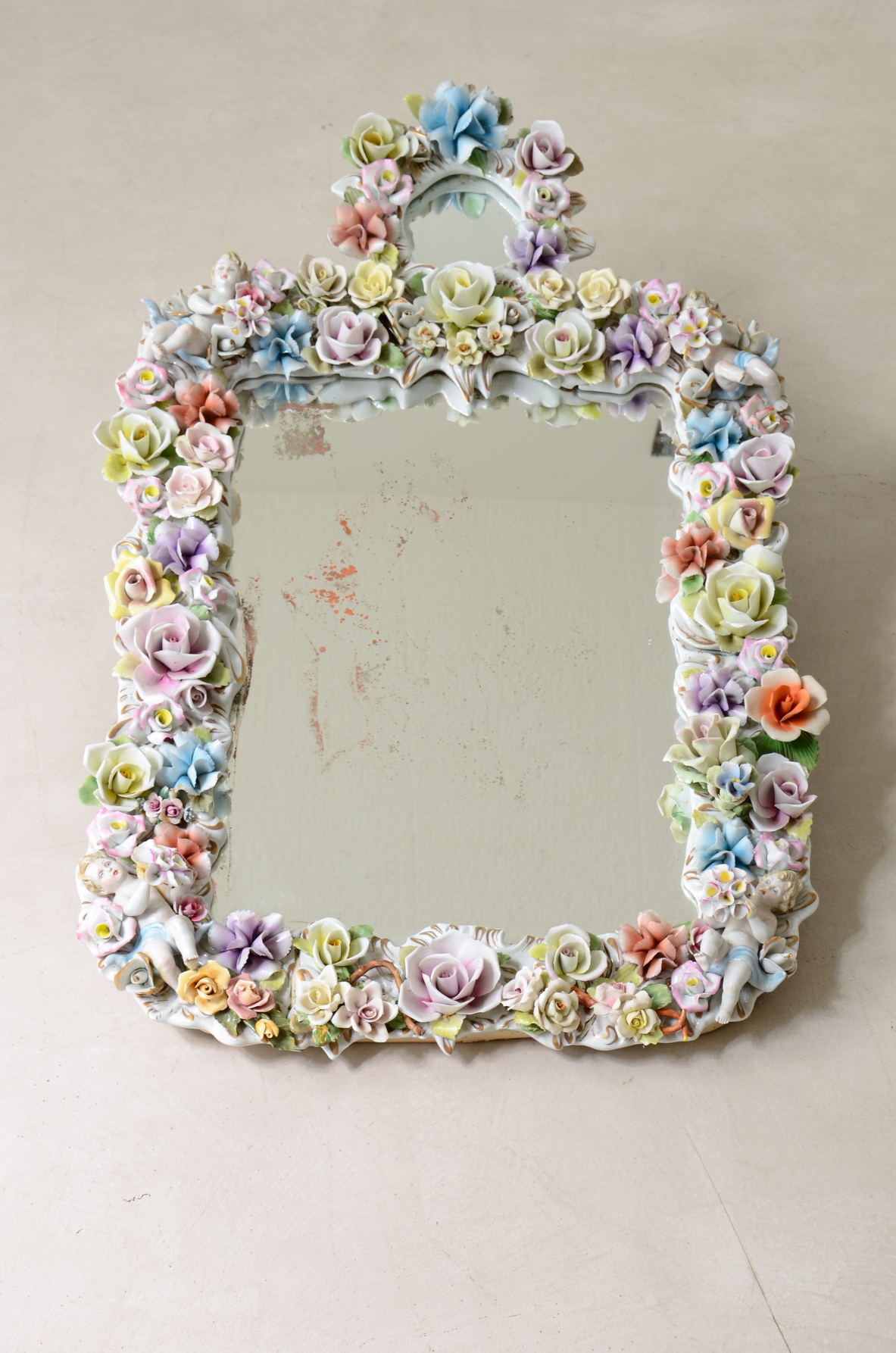 Mirror with important polychrome flower porcelain frame. Capodimonte manufacture