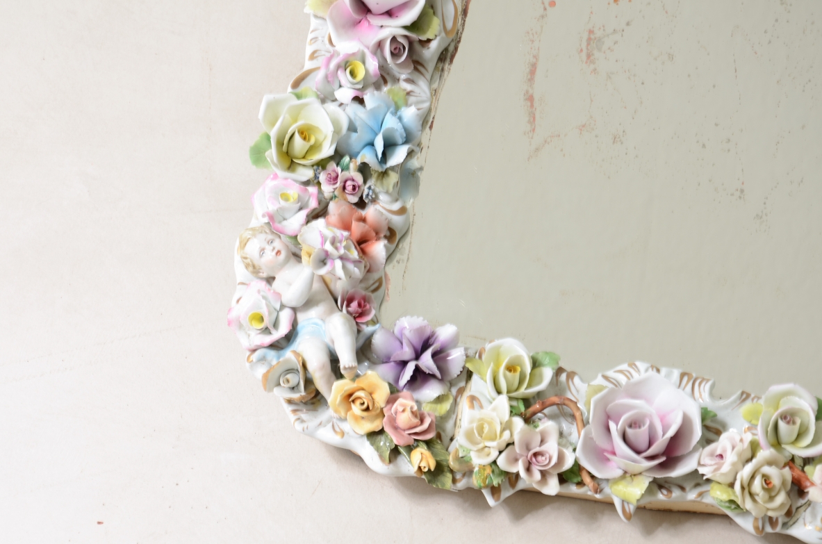 Mirror with important polychrome flower porcelain frame. Capodimonte manufacture