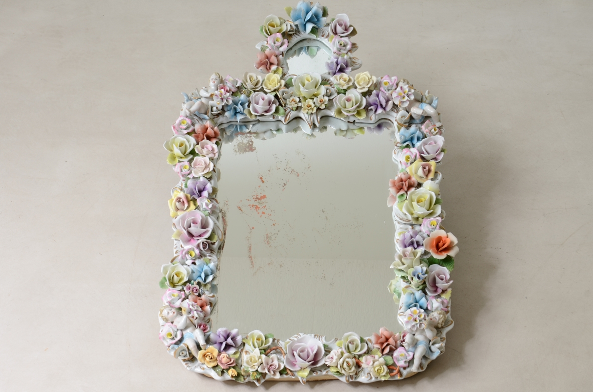 Mirror with important polychrome flower porcelain frame. Capodimonte manufacture