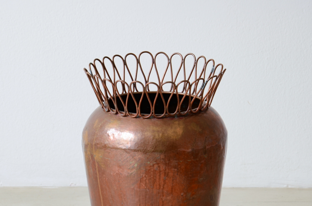 Gio Ponti  Turned copper umbrella stand with continuous ribbon crown.