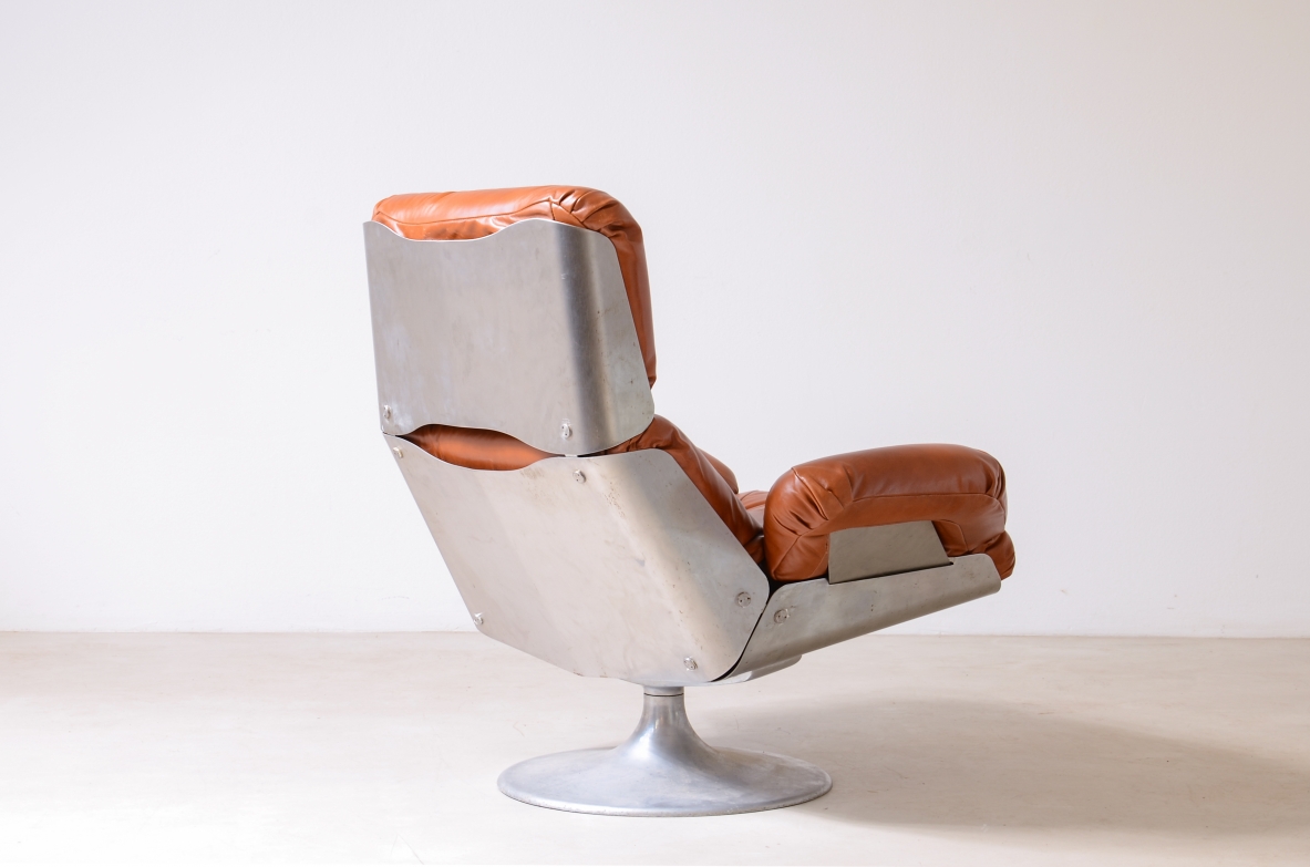 Xavier Feal  Rare swivel chair with footrest in curved steel and leather upholstery.  Inox Industrie, France, ca. 1970.v