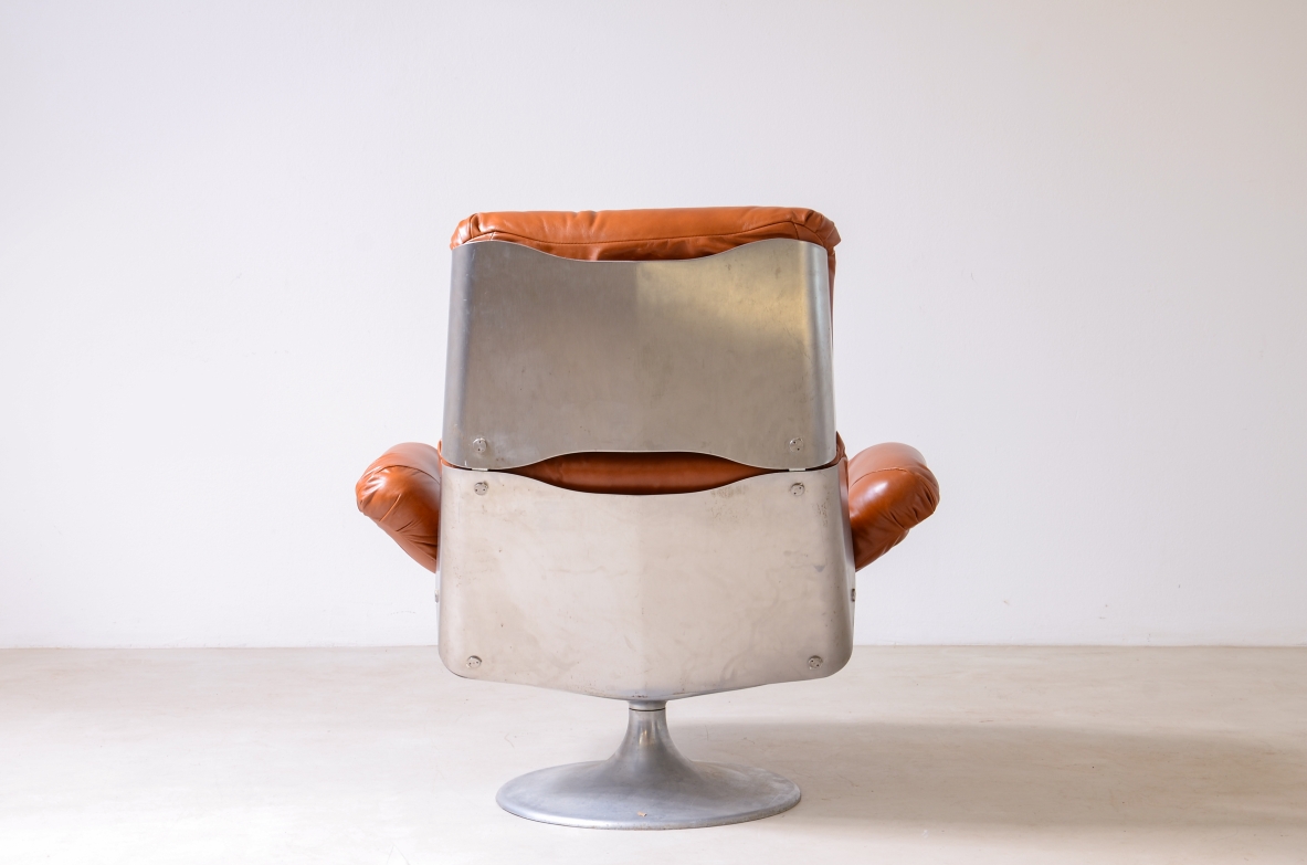 Xavier Feal  Rare swivel chair with footrest in curved steel and leather upholstery.  Inox Industrie, France, ca. 1970.v