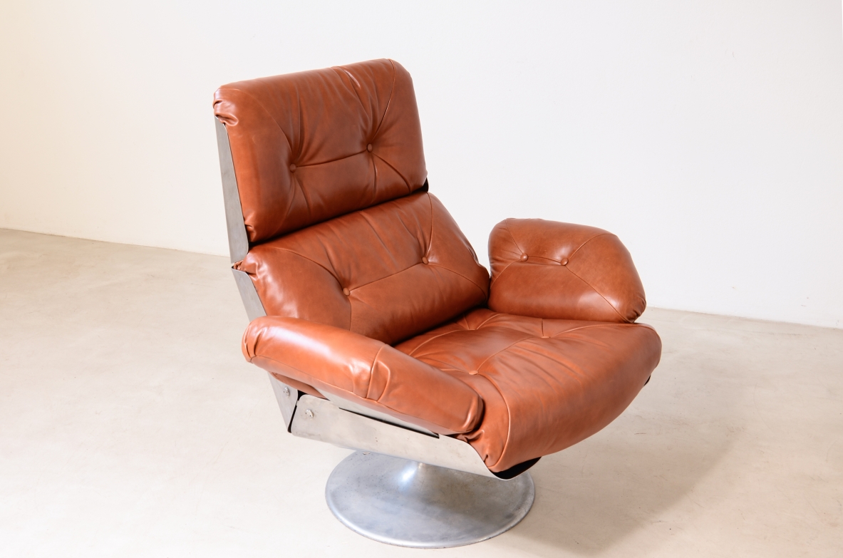Xavier Feal  Rare swivel chair with footrest in curved steel and leather upholstery.  Inox Industrie, France, ca. 1970.v
