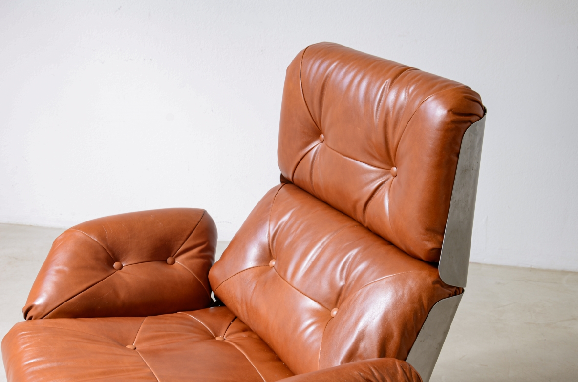 Xavier Feal  Rare swivel chair with footrest in curved steel and leather upholstery.  Inox Industrie, France, ca. 1970.v