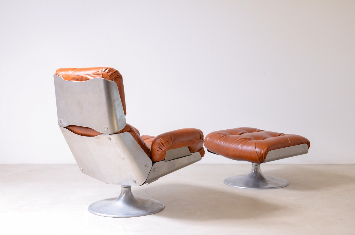 Xavier Feal  Rare swivel chair with footrest in curved steel and leather upholstery.  Inox Industrie, France, ca. 1970.v