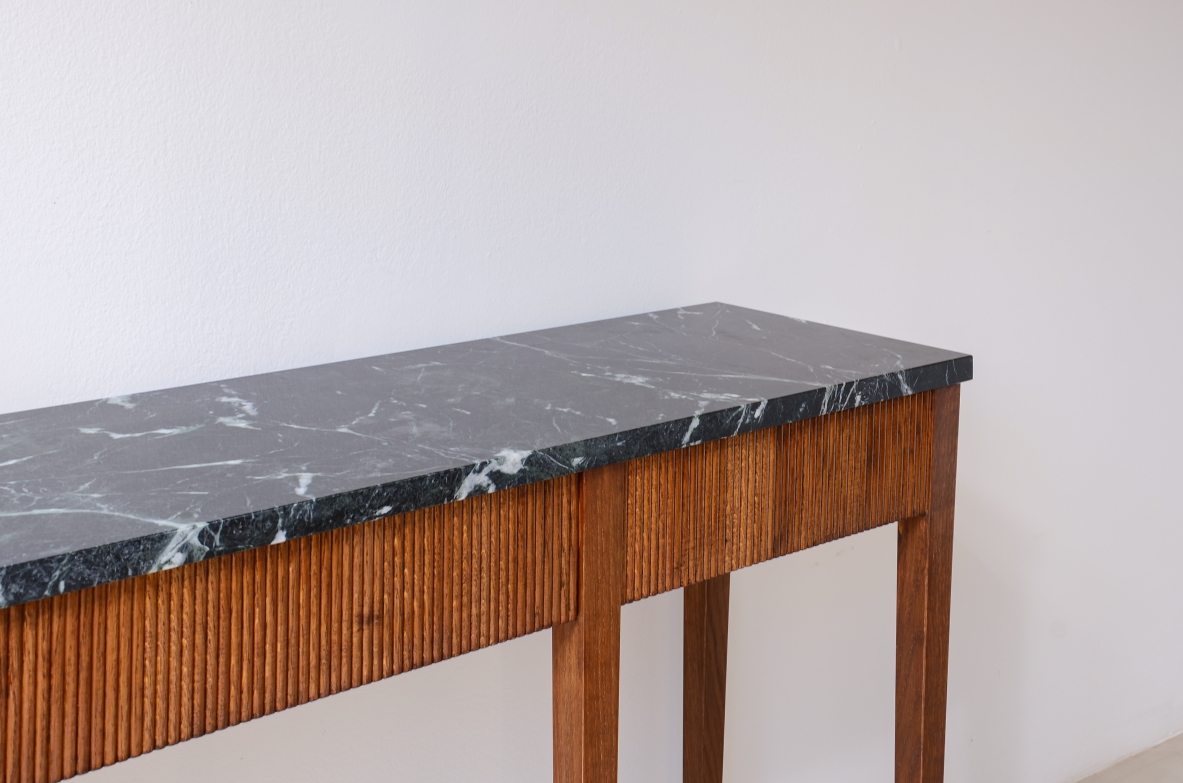 Paolo Buffa  Elegant console table in reeded Oak with a beautiful marble top.  1940's manufacturing