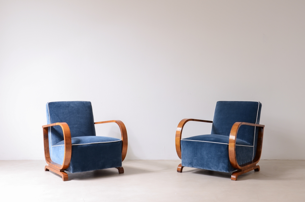 Pair of armchairs with curved wooden armrests and padded velvet seat.  Hungarian manufacture, 1930s-40s.