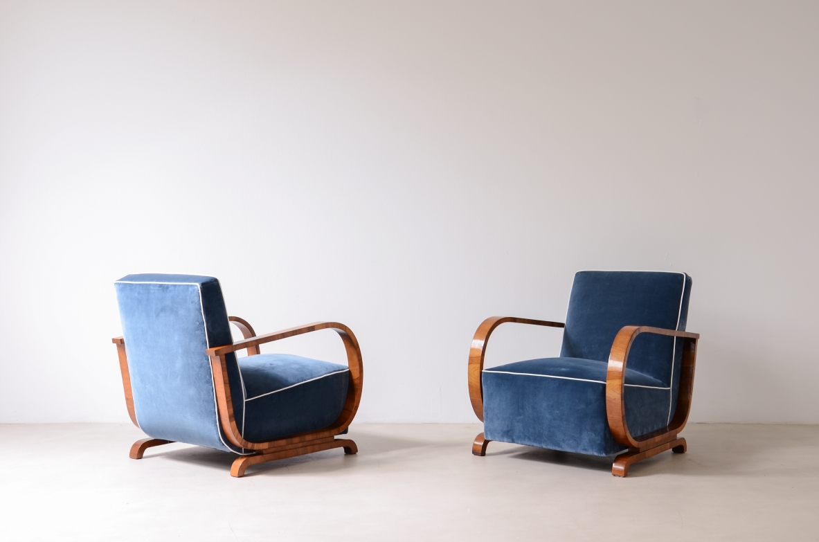 Pair of armchairs with curved wooden armrests and padded velvet seat.  Hungarian manufacture, 1930s-40s.