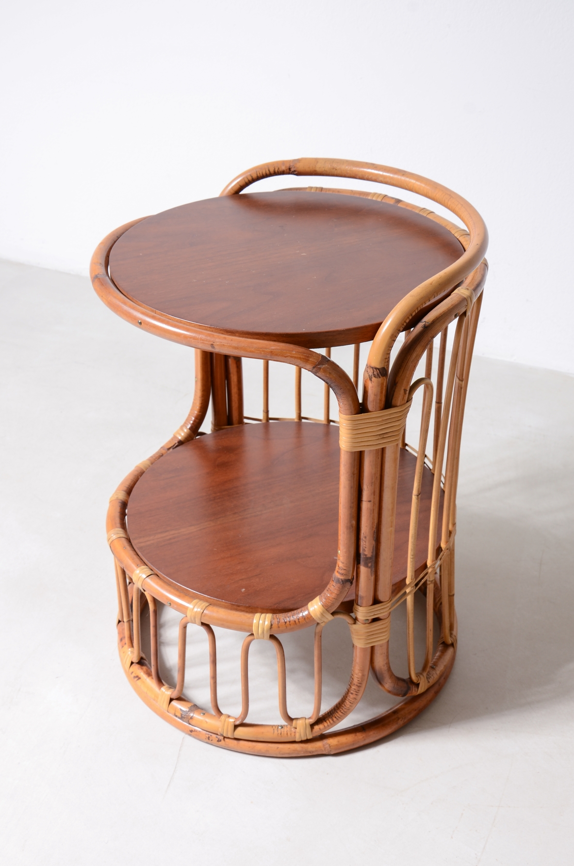 Pair of rattan nightstands with two wooden shelves.Italian manufacture 1960's