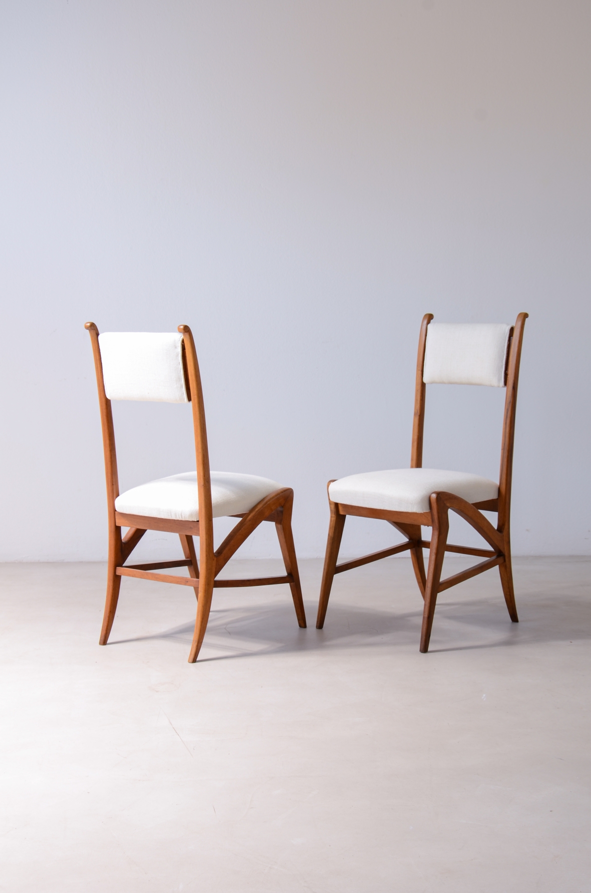 Pair of extraordinary oak chairs with upholstered fabric seat and back.  Attr. Guglielmo Pecorini, ca. 1940.