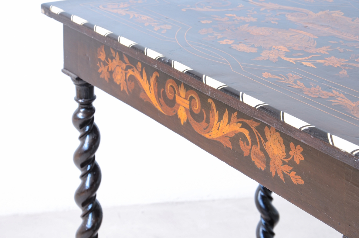 table finely inlaid in various woods and profiled in ivory 1850