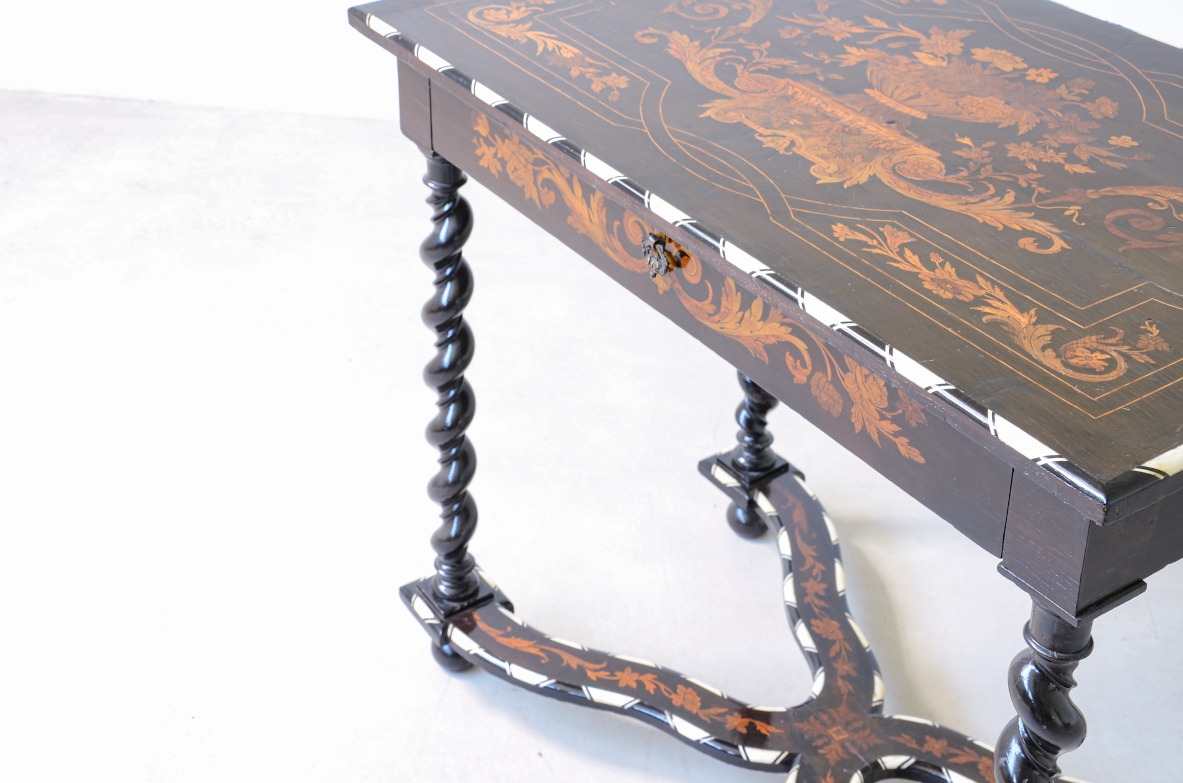 table finely inlaid in various woods and profiled in ivory 1850