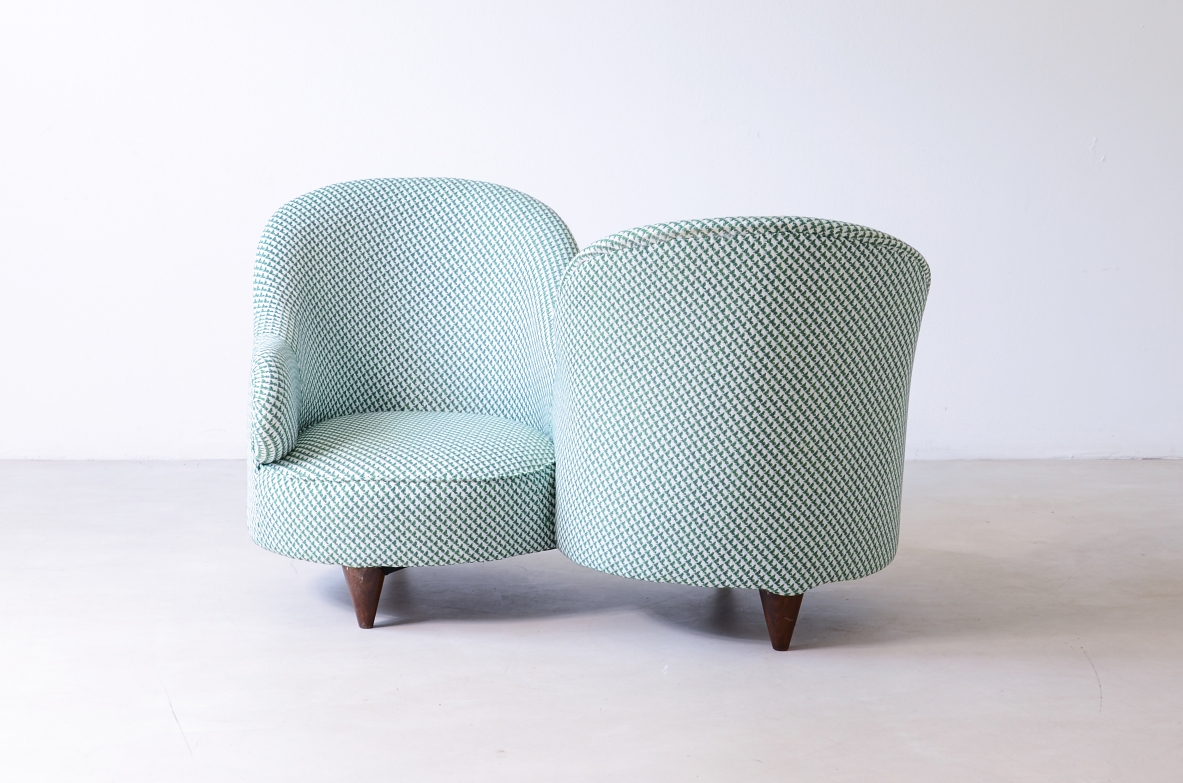 Conversation sofa for two, upholstered in padded fabric.  Italian manufacture, ca.1950.