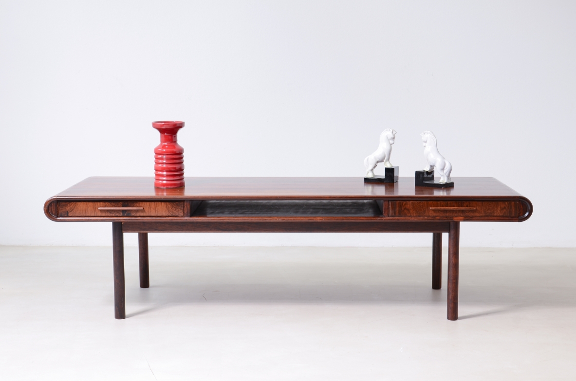 low table with two tops, an open compartment, and two drawers.Brazilian manufacture, ca. 1960.