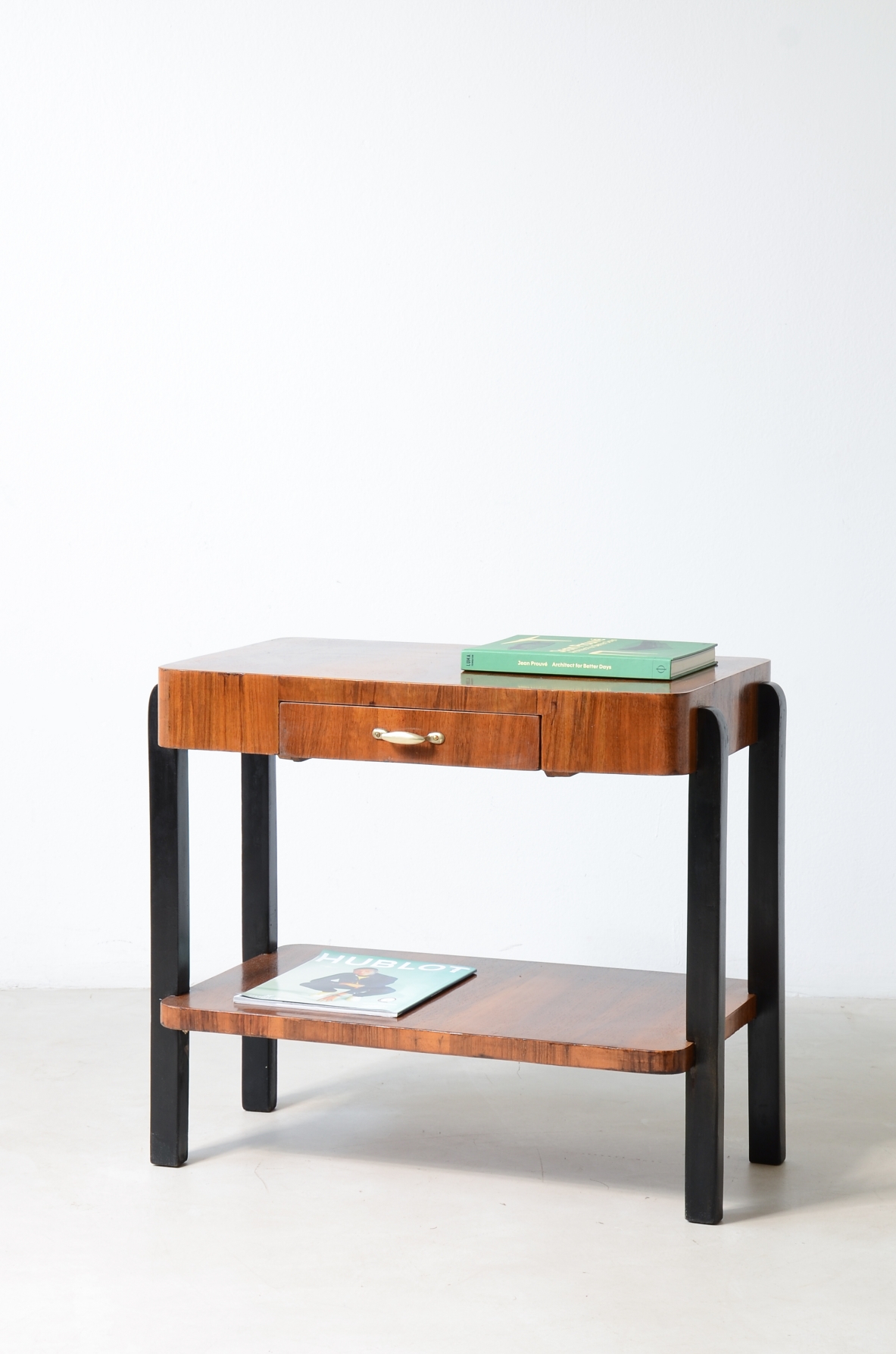 Walnut and stained wood coffee table with two shelves. Made in the 1930s.