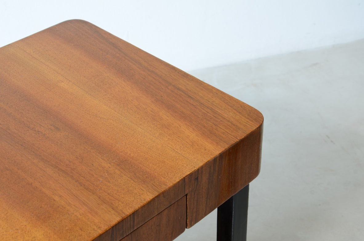Walnut and stained wood coffee table with two shelves. Made in the 1930s.