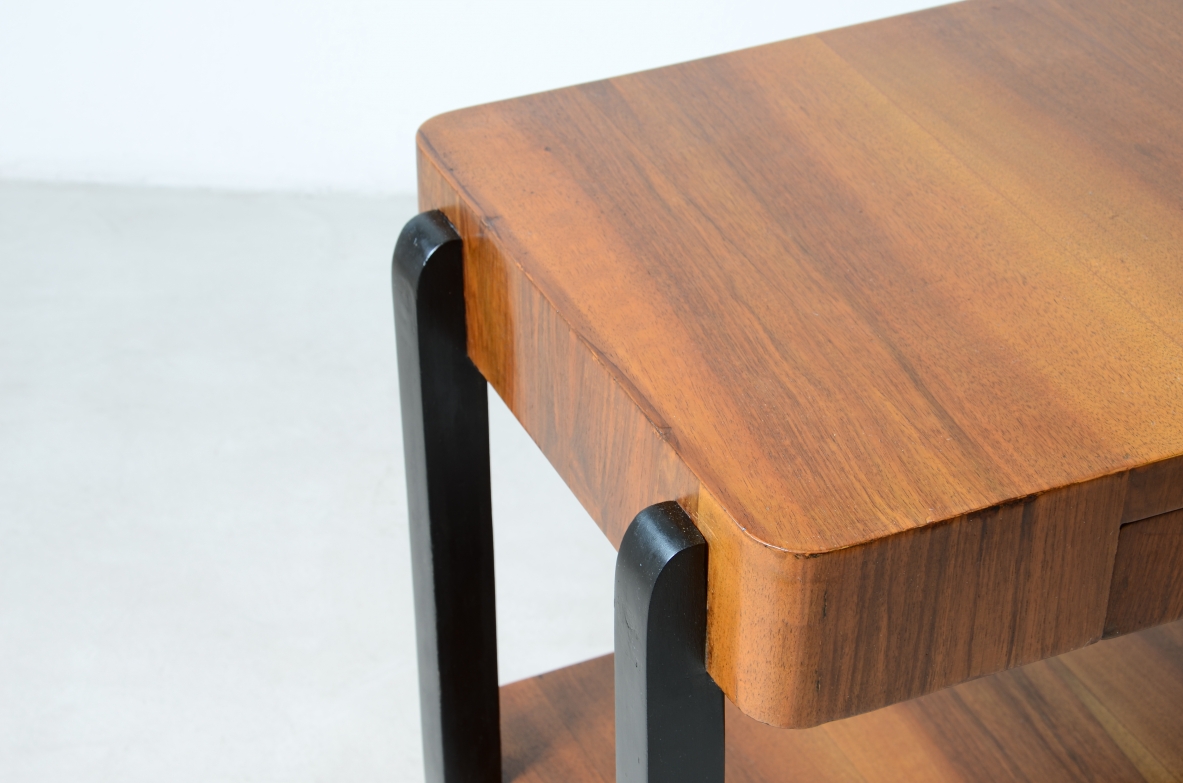 Walnut and stained wood coffee table with two shelves. Made in the 1930s.