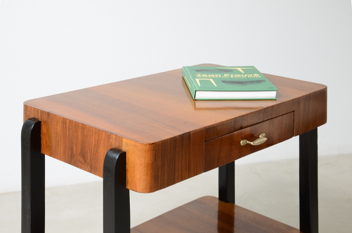 Walnut and stained wood coffee table with two shelves. Made in the 1930s.