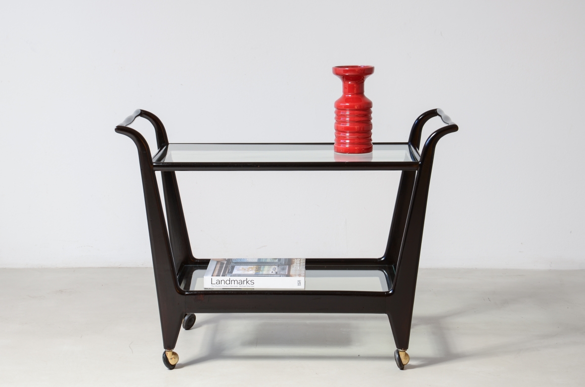Stained wood serving trolley with two cut glass shelves.  Italian manufacture, ca. 1950.