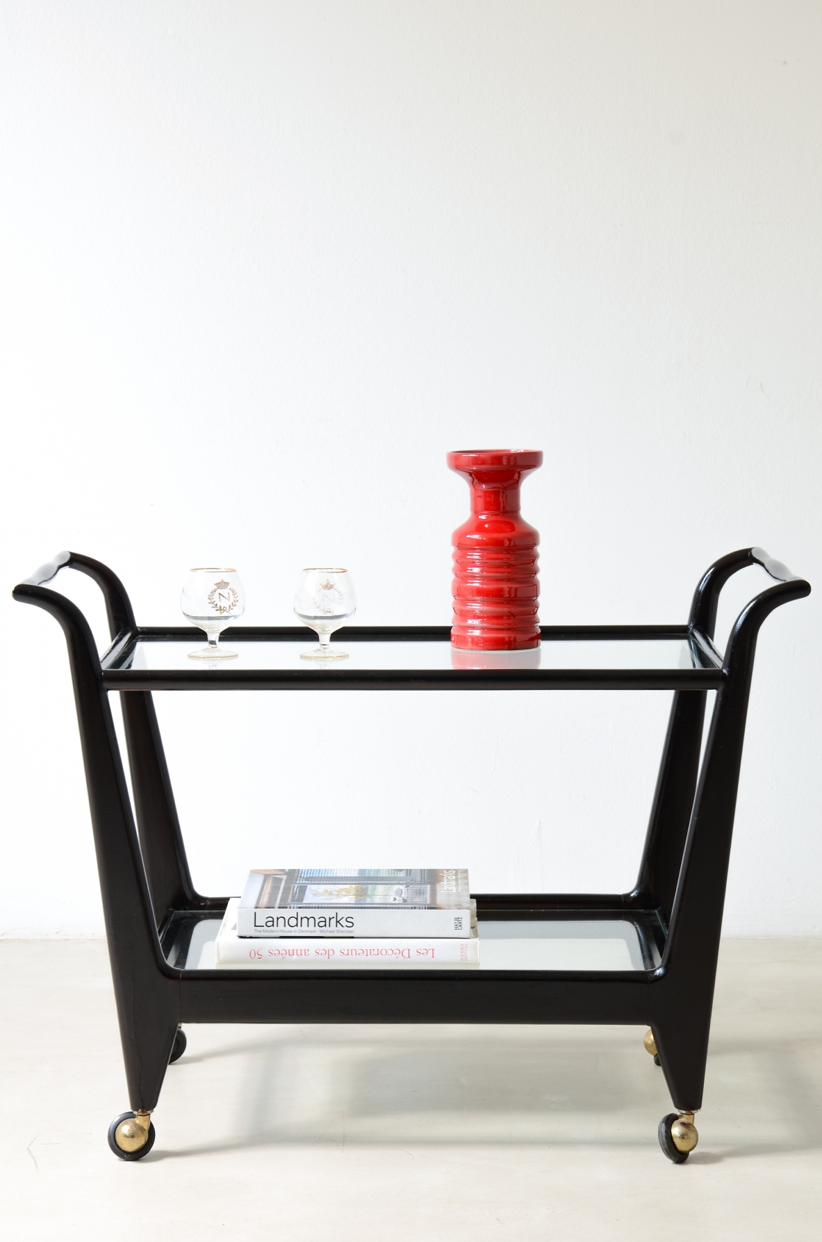 Stained wood serving trolley with two cut glass shelves.  Italian manufacture, ca. 1950.
