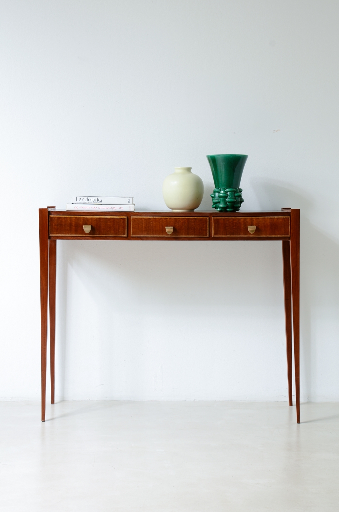 Elegant console table with three drawers on the front. talian manufacture, ca. 1955.