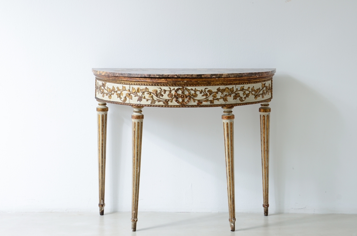 Splendid half-moon console table in lacquered and gilded wood. Made in Naples, ca. 1780-1790.