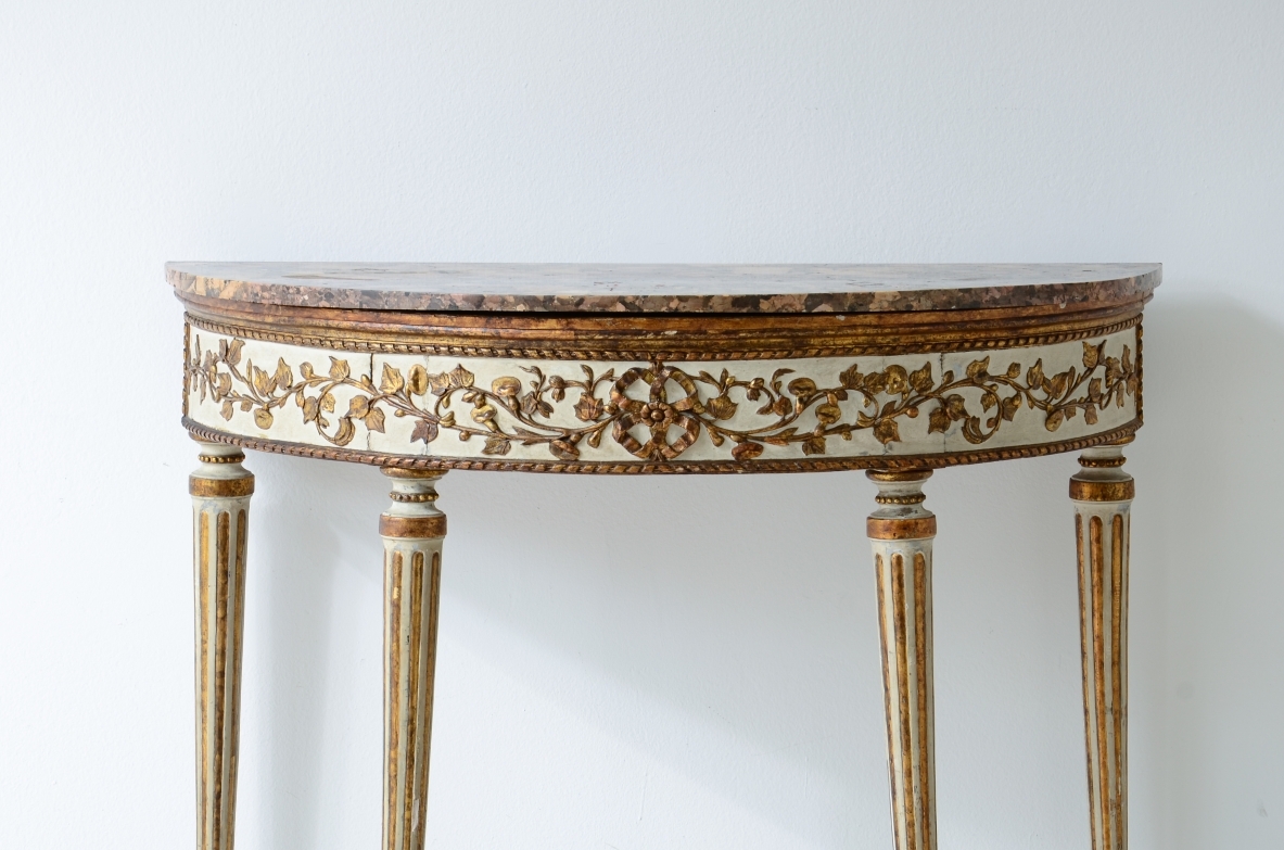 Splendid half-moon console table in lacquered and gilded wood. Made in Naples, ca. 1780-1790.