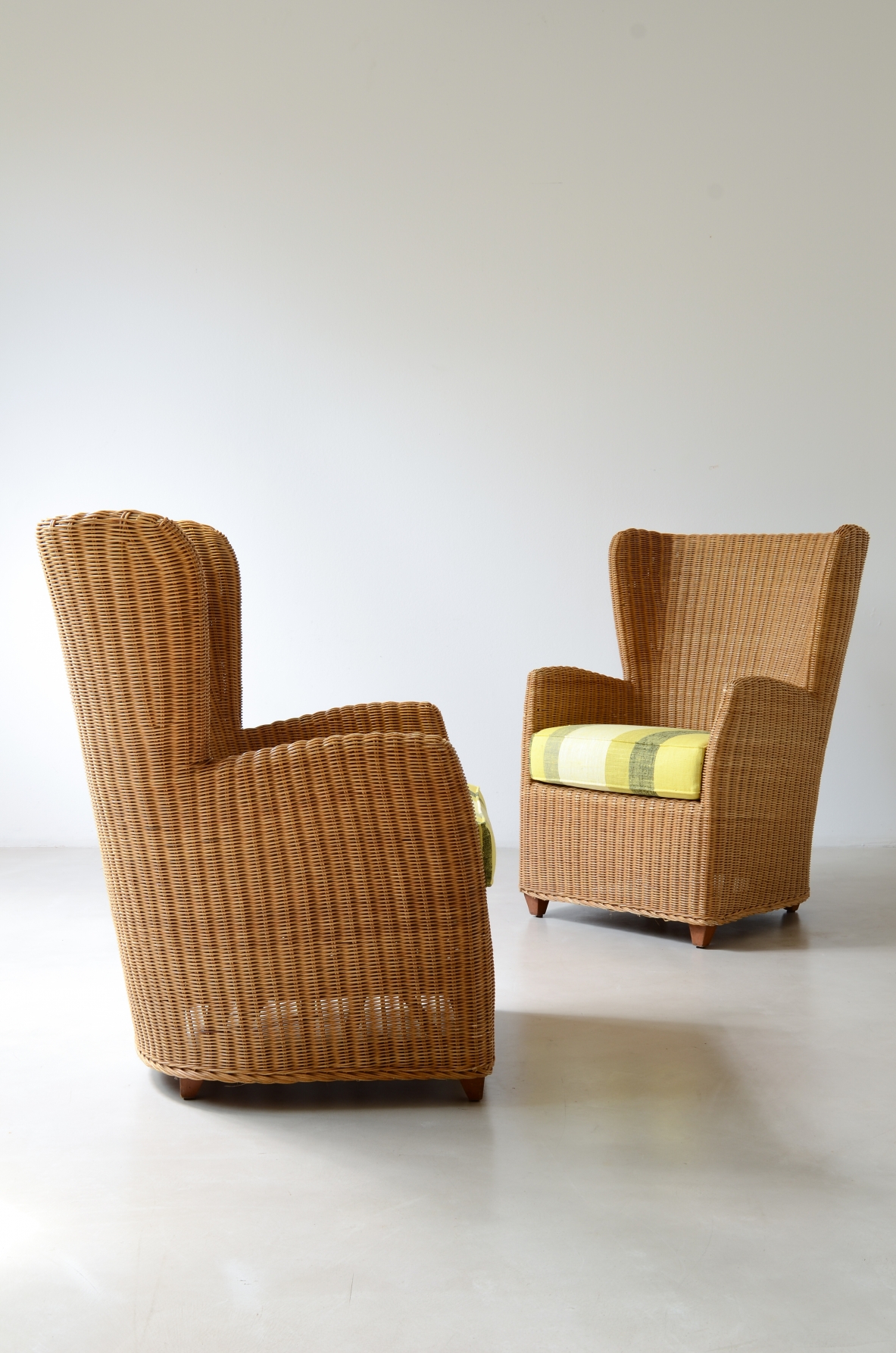 Two large woven rattan armchairs, Italian manufacture