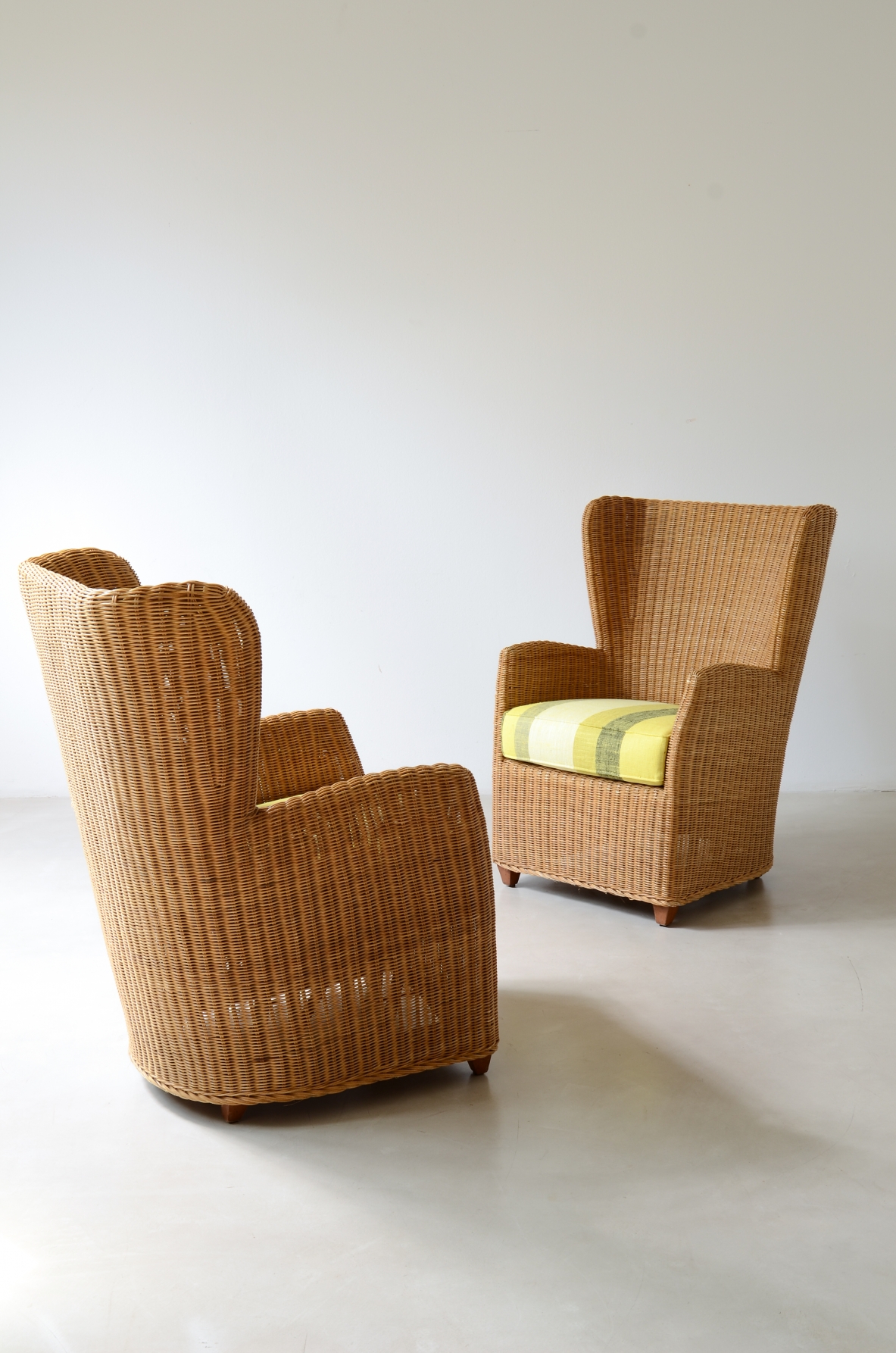 Two large woven rattan armchairs, Italian manufacture