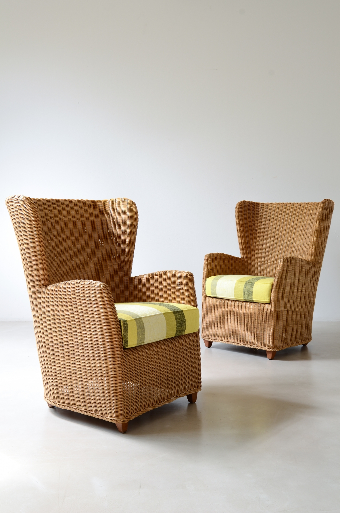 Two large woven rattan armchairs, Italian manufacture