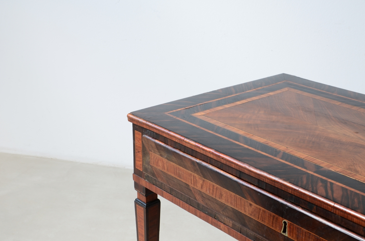 Elegant centerpiece writing table in fine wood veneer.  Italy, ca. 1780.