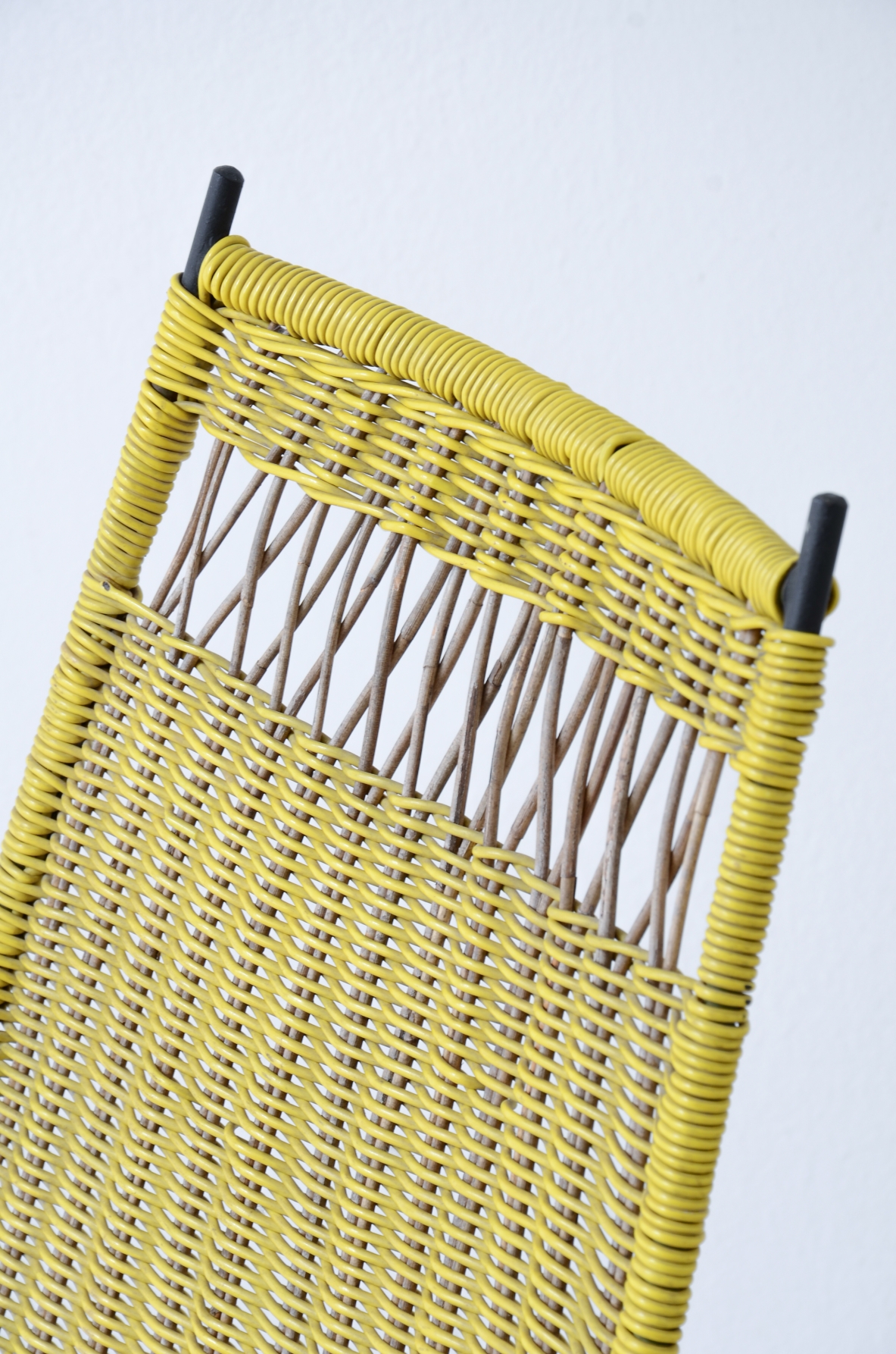 Pair of armchairs with an iron frame and woven rubber and rattan thread.Saporiti Italia, ca. 1950.