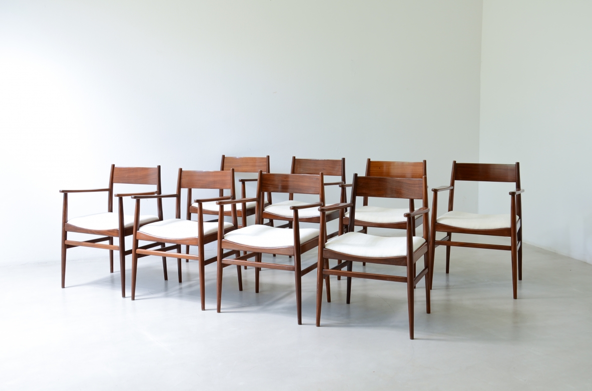 Raro set di 8 eleganti poltroncine in  legno di tek sagomato. Manifattura L.Jacobsen, 1960ca.