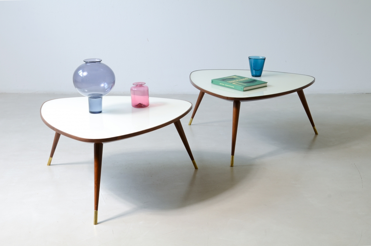 Osvaldo Borsani  Pair of elegant coffee tables with a beveled glass top. Reissue by Officina Antiquaria