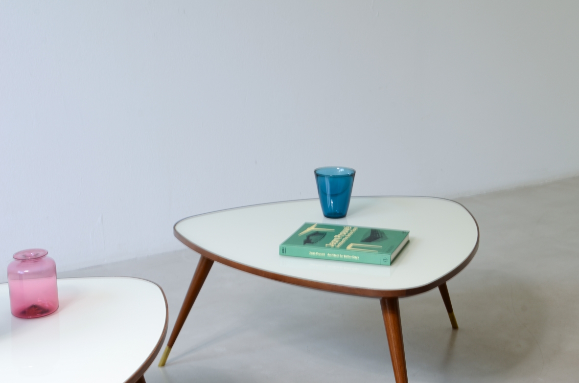 Osvaldo Borsani  Pair of elegant coffee tables with a beveled glass top. Reissue by Officina Antiquaria