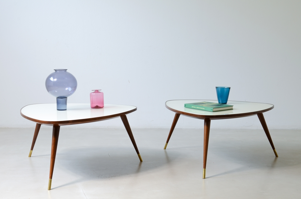 Osvaldo Borsani  Pair of elegant coffee tables with a beveled glass top. Reissue by Officina Antiquaria