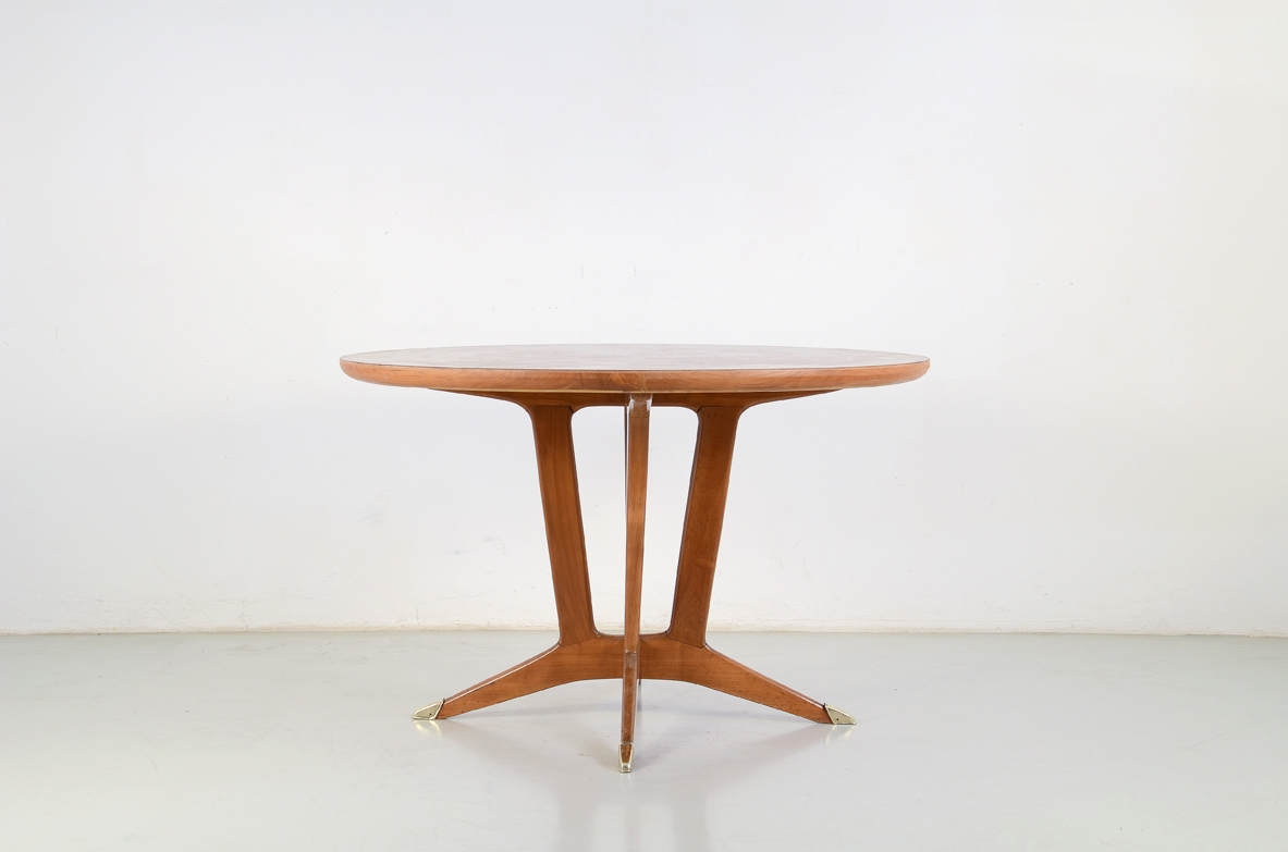 Elegant Italian 1950's table in cherry wood with bronze tips.