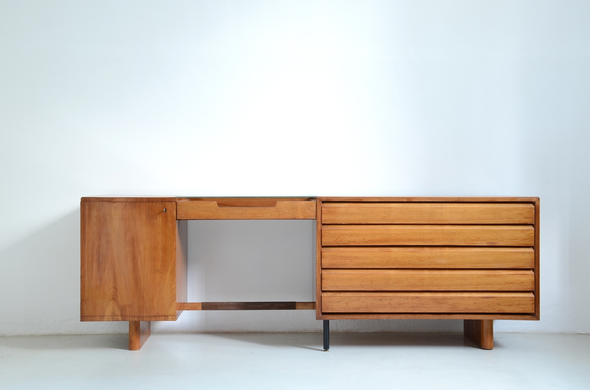 Italian 1950's sideboard in light walnut with five drawers, a nice desk and a bar cabinet.