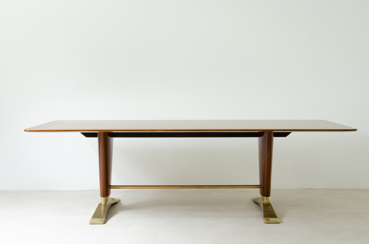 Large walnut table with two uprights held by a brass crosspiece and important bases in cast bronze.  1940's Italian manufacture.