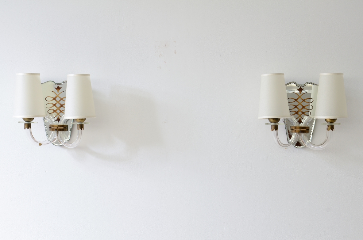 Emilio Lancia  Pair of wall lamps with elegant blown glass arms, shaped fan in engraved and mirrored crystal with brass profile.  1930's manufacture.