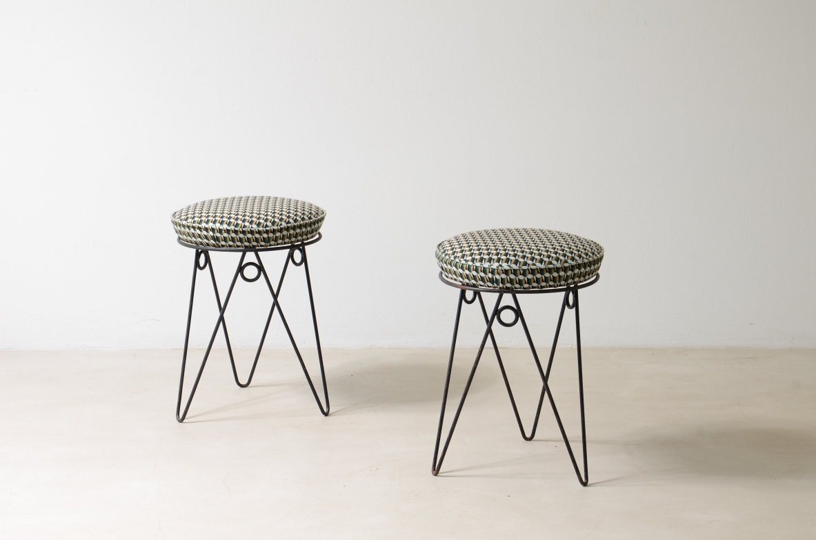 Pair of stools with wrought iron base and fabric seat.  France, 1950ca.