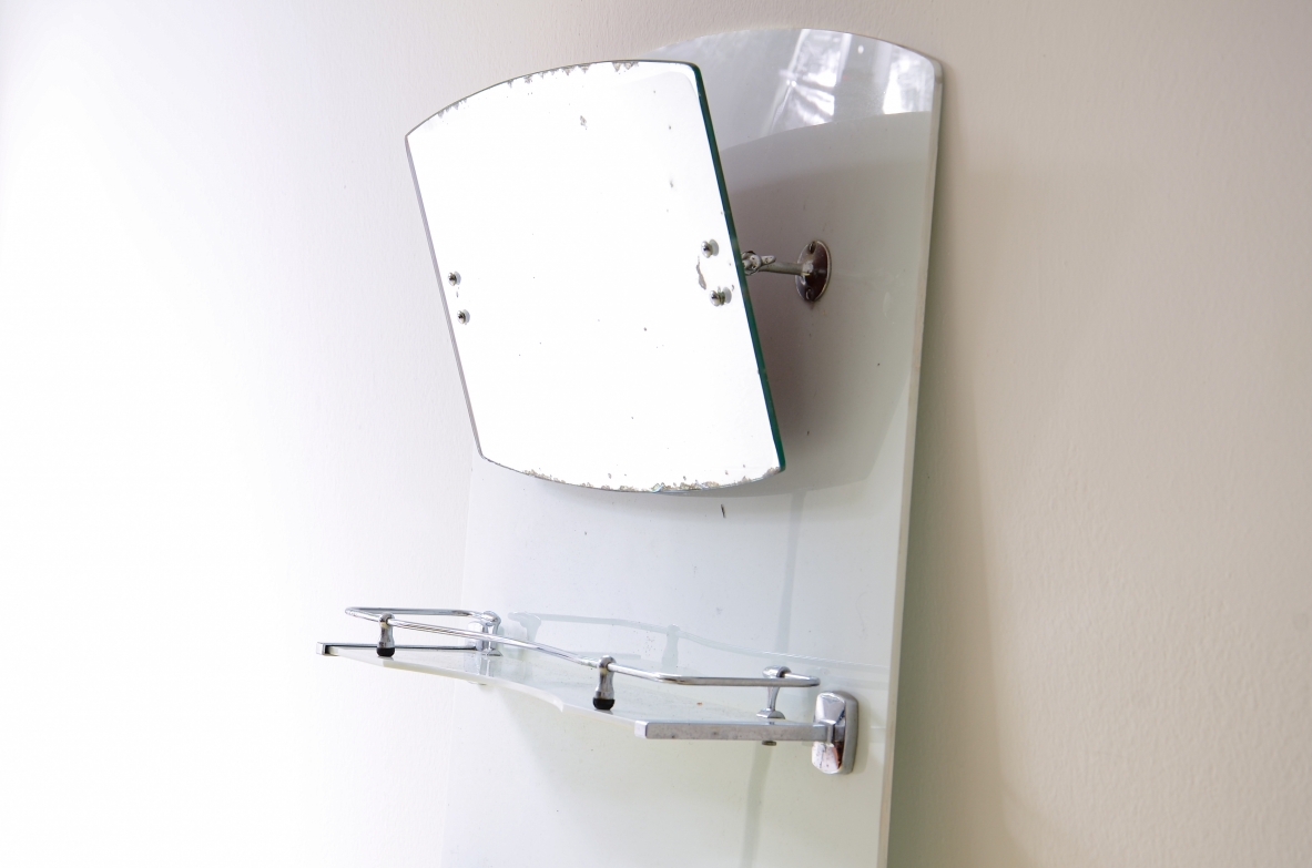 White opaline bathroom mirror with tilting mirror, shelf, and chrome-plated soap dish.1930